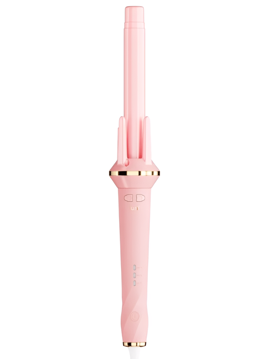 Pink hair curler with gold accents on a white background